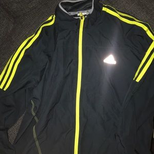 Navy and neon green Adidas windbreaker